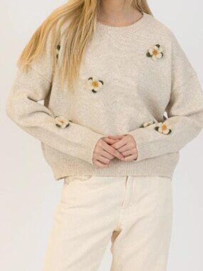 This floral pullover adds just the right dose of charm to your look